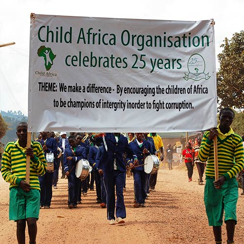 Child Africa celebrating 25 years of operation, marching through Kabale town