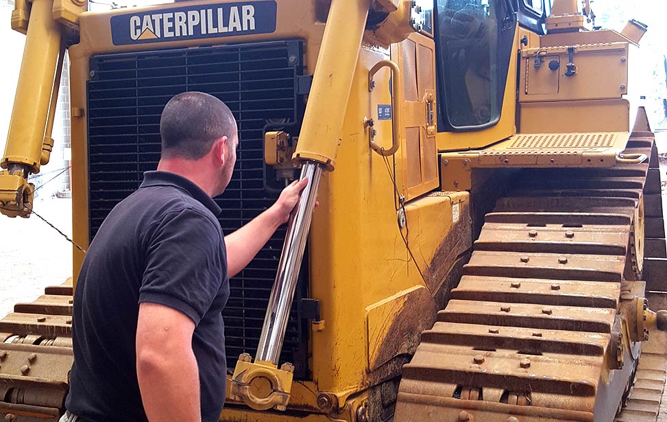 Pieter Quaegebeur inspects Better Globe Forestry's new Caterpillar bulldozer