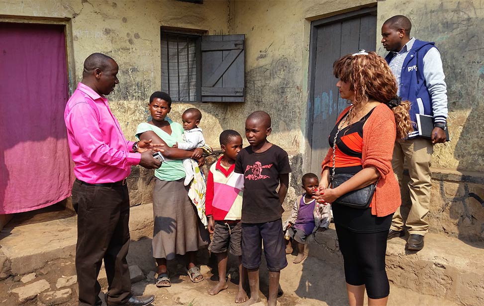 Julie Solberg visiting the homes of Child Africa students